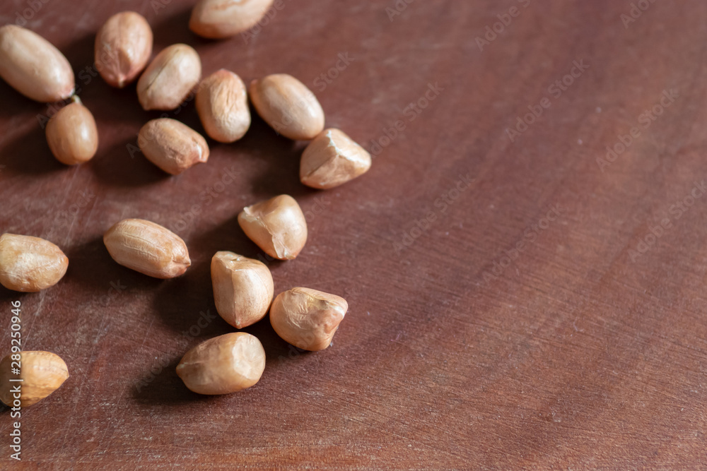 Raw Peanuts on wooden background Raw Peanuts on wooden background