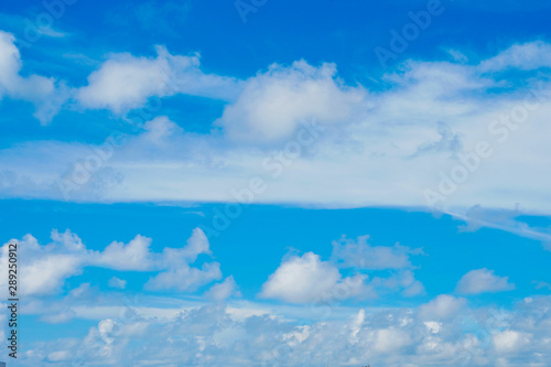 Blue sky and white clouds background.