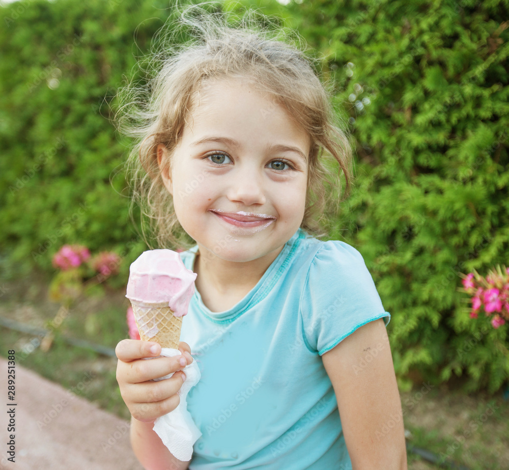 cute smiling little girl eating ice cream cute smiling little girl eating ice cream