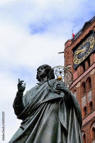 The Nicolaus Copernicus Monument in Torun - home town of astronomer Nicolaus Copernicus. Statue in front of the Old Town Hall  Torun  Poland.  