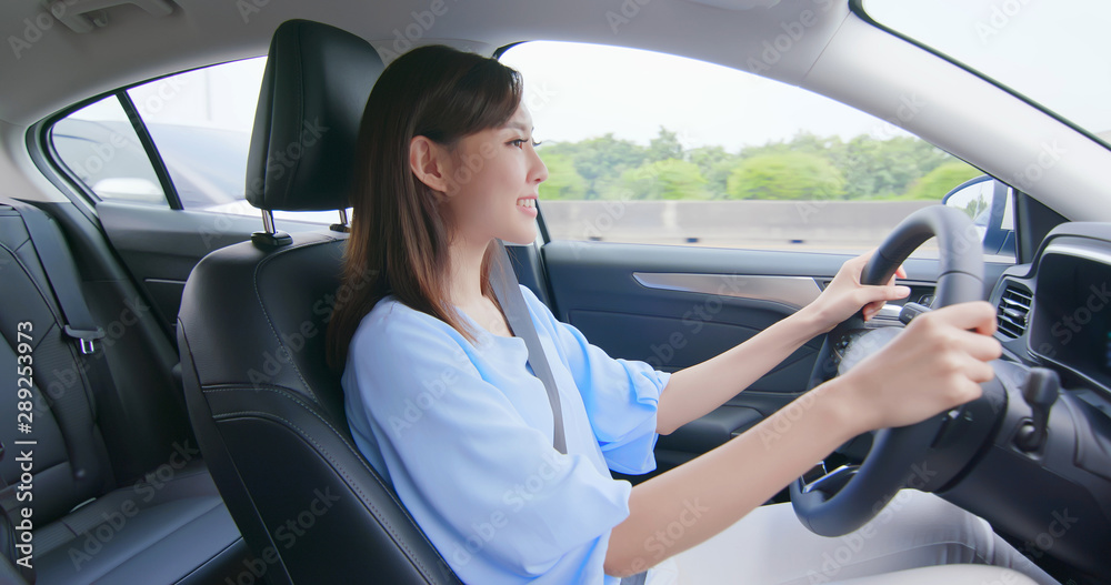 asian woman driving car