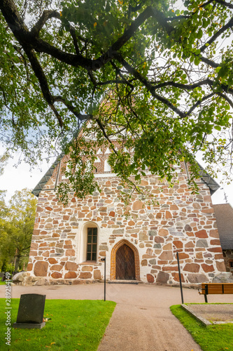 Hollola, Finland - 9 September 2019: Old medieval stone church of St. Mary in Hollola, Finland © Elena Noeva