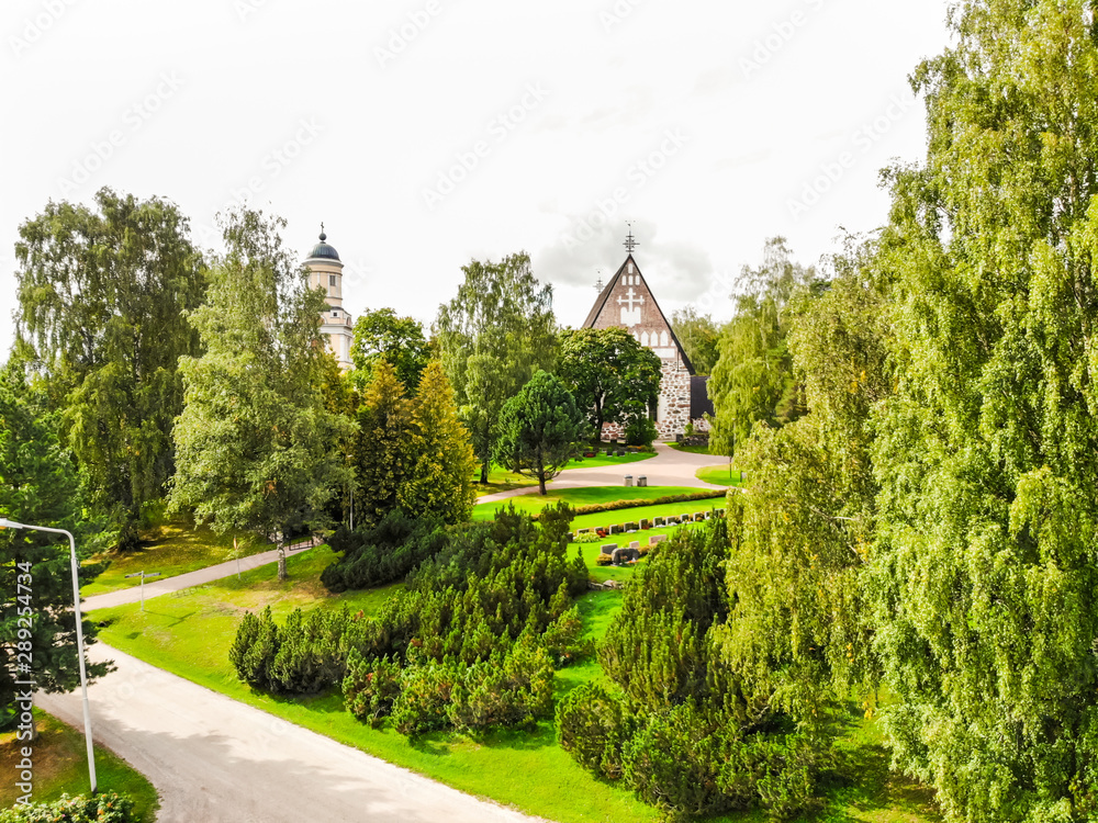 Naklejka premium Hollola, Finland - 9 September 2019: Aerial view of old medieval stone church of St. Mary in Hollola, Finland