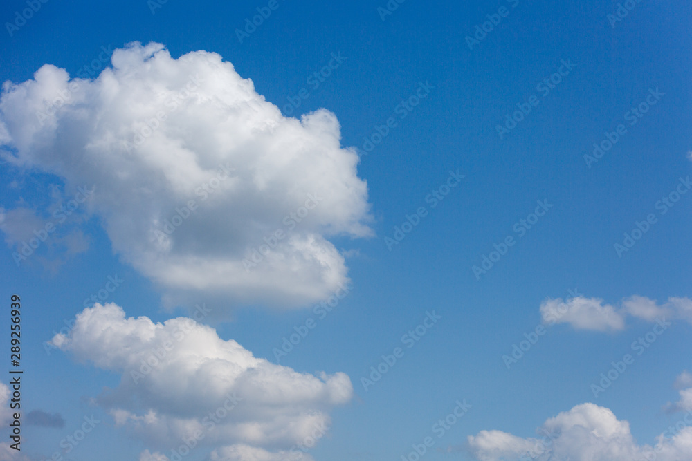 Beautiful and thick clouds in the blue sky. Cloudy sky on a clear day Beautiful and thick clouds in the blue sky. Cloudy sky on a clear day