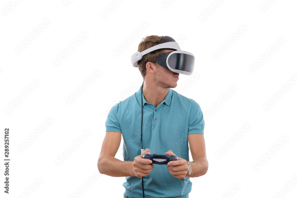 Caucasian young boy playing with reality glasses and virtual console controller dressed in a blue polo shirt isolated in white background Caucasian young boy playing with reality glasses and virtual console controller dressed in a blue polo shirt isolated in white background