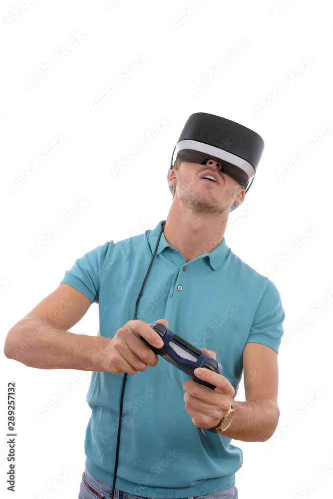 Caucasian young boy playing with reality glasses and virtual console controller dressed in a blue polo shirt isolated in white background Caucasian young boy playing with reality glasses and virtual console controller dressed in a blue polo shirt isolated in white background