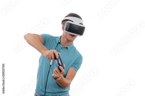 Caucasian young boy playing with reality glasses and virtual console controller dressed in a blue polo shirt isolated in white background