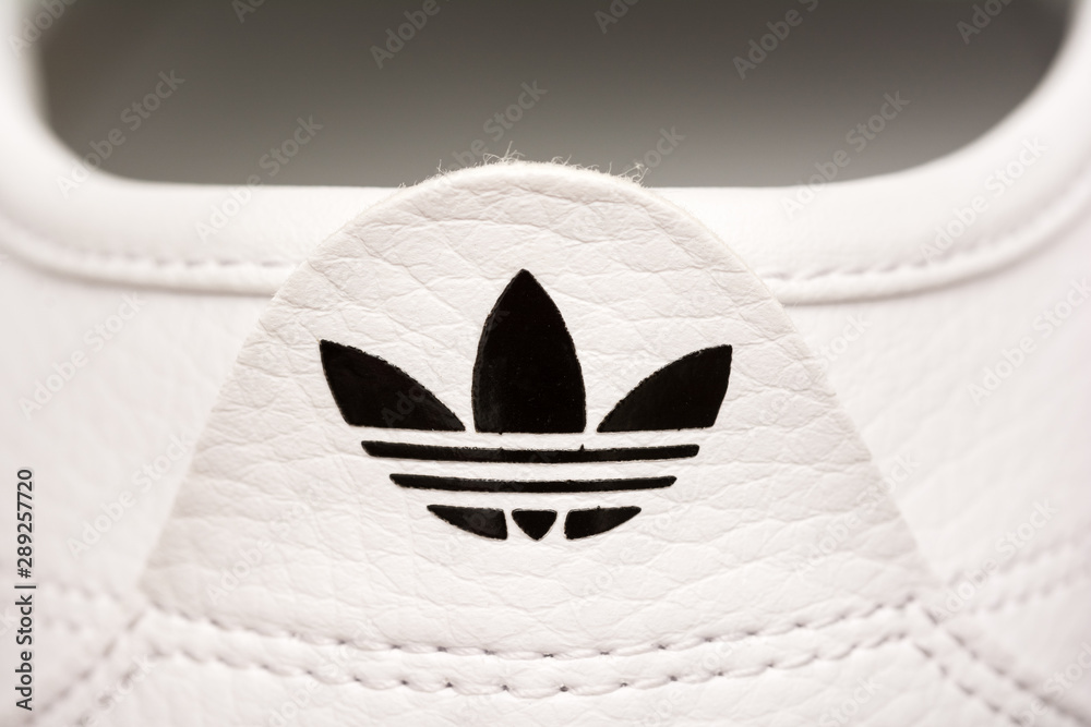 BUCHAREST, ROMANIA - JULY 23, 2014: Adidas Sport Shoes Close Up. Founded in  1924 is a German multinational corporation that designs and manufactures  sports shoes, clothing and accessories. Stock Photo | Adobe Stock