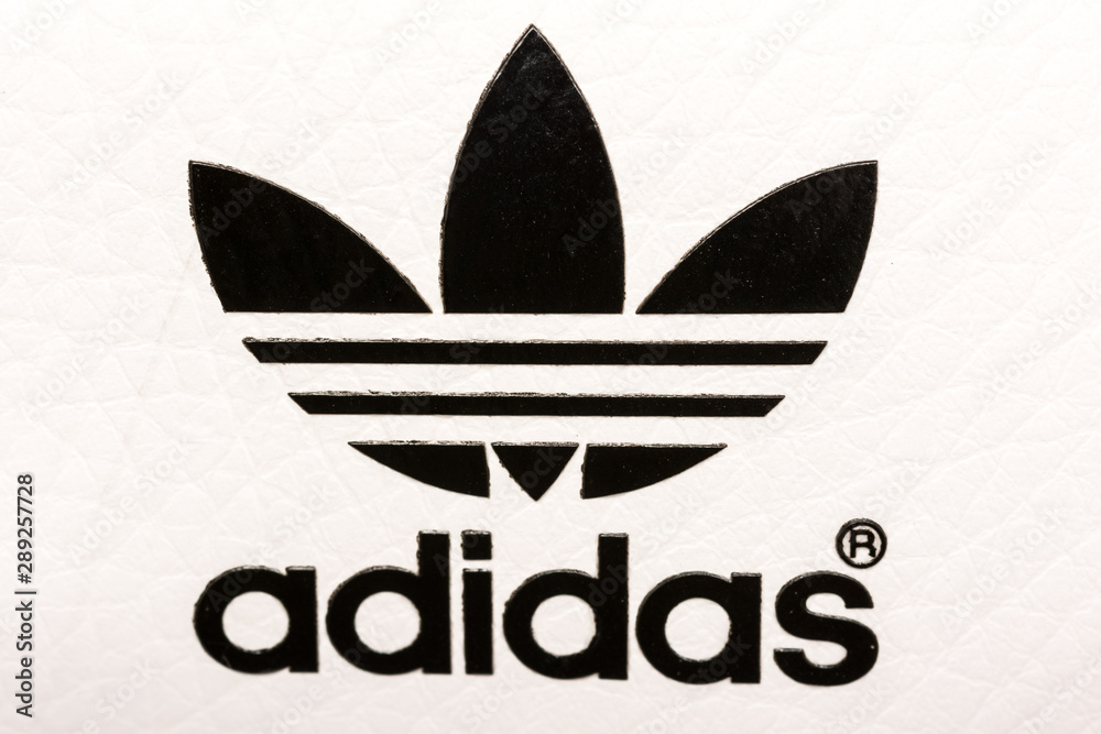 BUCHAREST, ROMANIA - JULY 23, 2014: Adidas Sign On Adidas Sport Shoes.  Founded in 1924 is a German multinational corporation that designs and  manufactures sports shoes, clothing and accessories. Stock Photo | Adobe  Stock