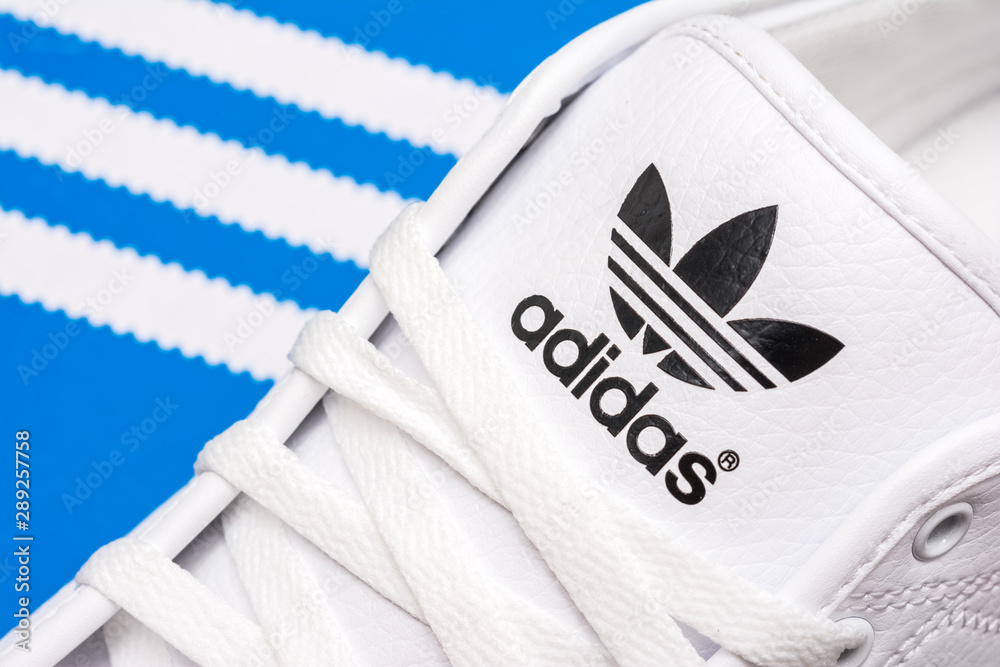 BUCHAREST, ROMANIA - JULY 23, 2014: Adidas Sport Shoes Close Up. Founded in  1924 is a German multinational corporation that designs and manufactures  sports shoes, clothing and accessories. Stock Photo | Adobe Stock