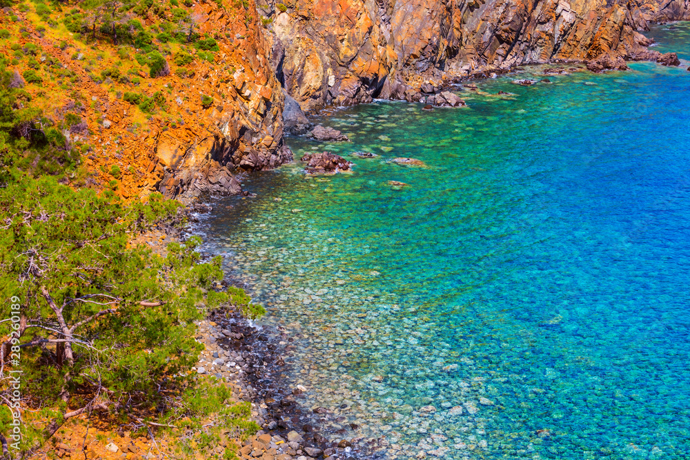 view from a top to the emerald sea bay, sea beach with rocky coast, summer sea background