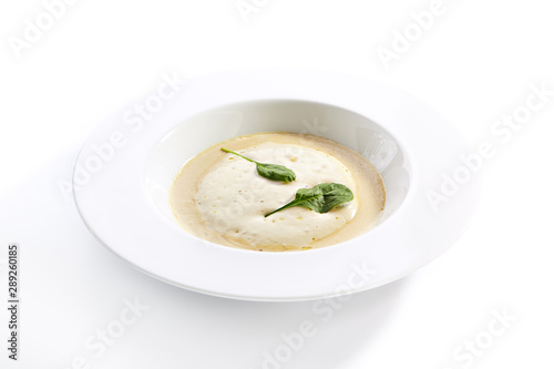 Cream soup with boletus forest mushrooms closeup