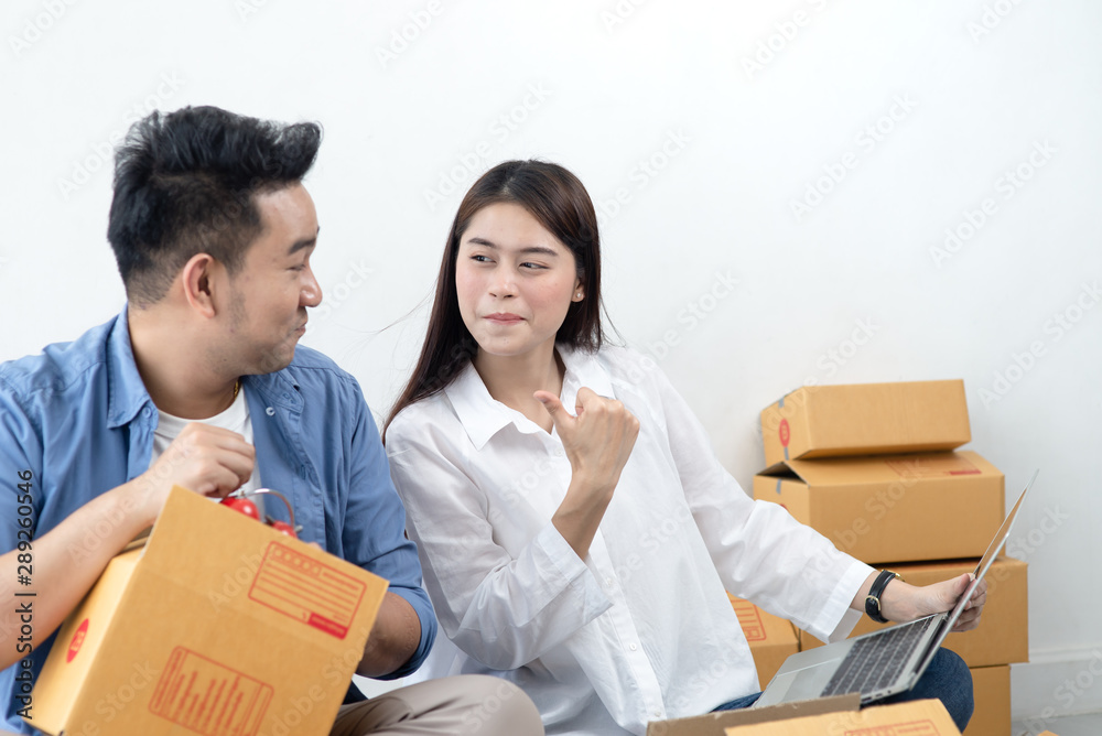 Asian couple with stack of parcel boxes, online business and delivery concept. Asian couple with stack of parcel boxes, online business and delivery concept.
