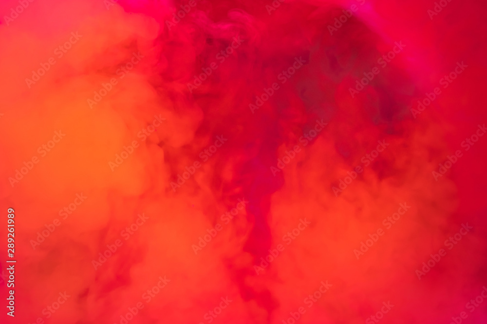 Paints dissolved in water with a beautiful spectacular blur. Trending neon orange colors. Bright amazing abstract background. Smoke effect.. Paints dissolved in water with a beautiful spectacular blur. Trending neon orange colors. Bright amazing abstract background. Smoke effect..