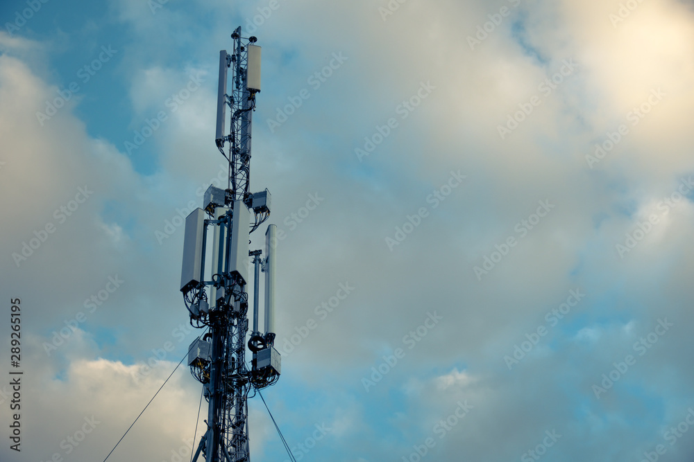 Cellular antenna. Mobile phone communication tower with blue sky Cellular antenna. Mobile phone communication tower with blue sky