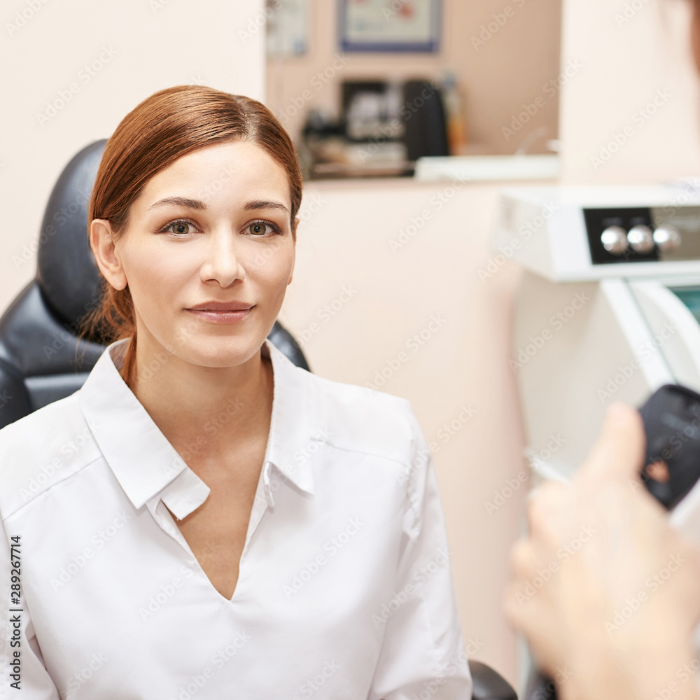Eye ophthalmologist exam. Eyesight recovery. Astigmatism check concept. Ophthalmology diagmostic device. Beauty girl portrait in clinic Eye ophthalmologist exam. Eyesight recovery. Astigmatism check concept. Ophthalmology diagmostic device. Beauty girl portrait in clinic