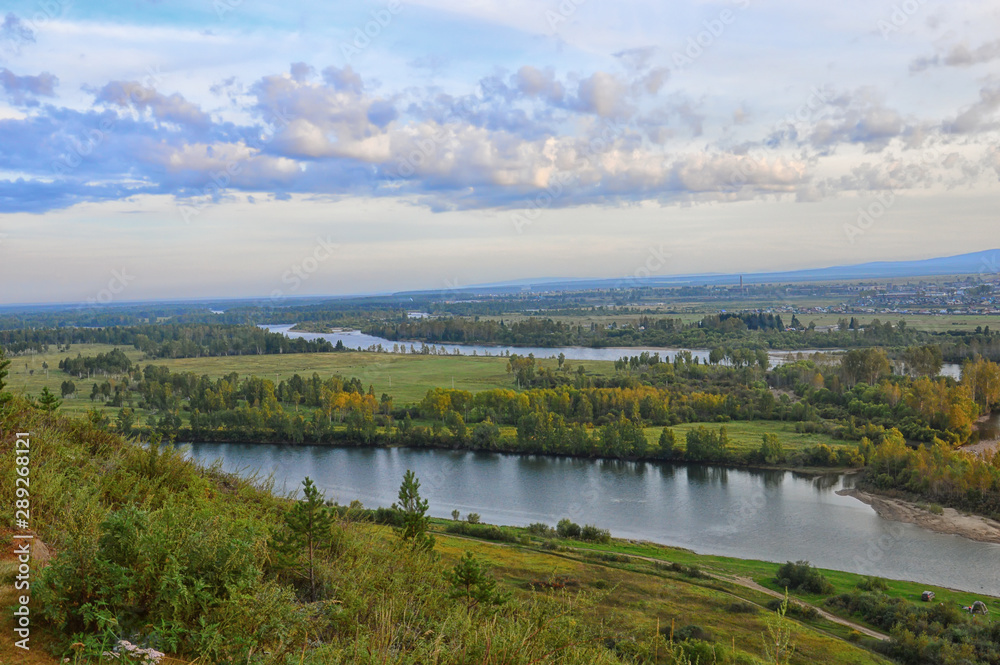 Panoramic aerial view of the Siberian River Valley. Scenery. Autumn day. On the Sunset