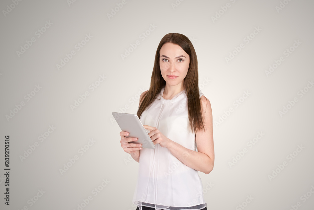 Young girl with tablet. Business woman write on laptop. Adorable caucasian businesswoman Young girl with tablet. Business woman write on laptop. Adorable caucasian businesswoman
