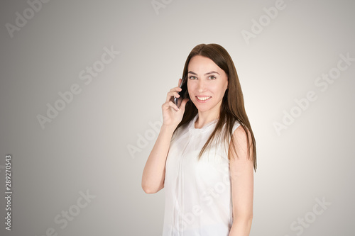 Young girl with mobilephone. Business woman talking on phone. Adorable caucasian businesswoman shopping