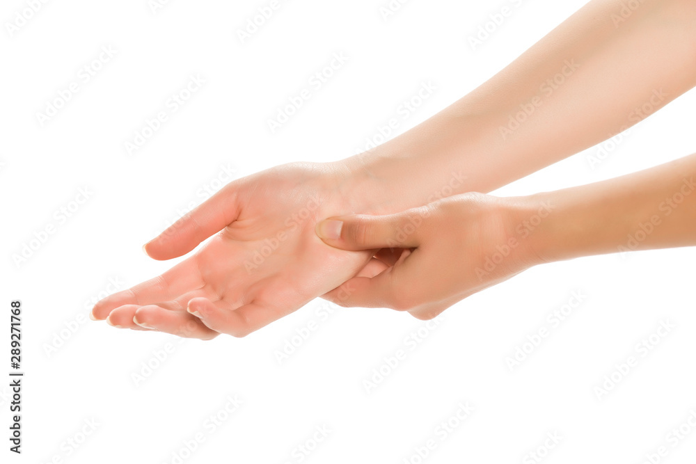 Hands of a young woman, massaging palm, isolated.