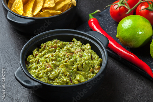 Bowl of guacamole with corn chips