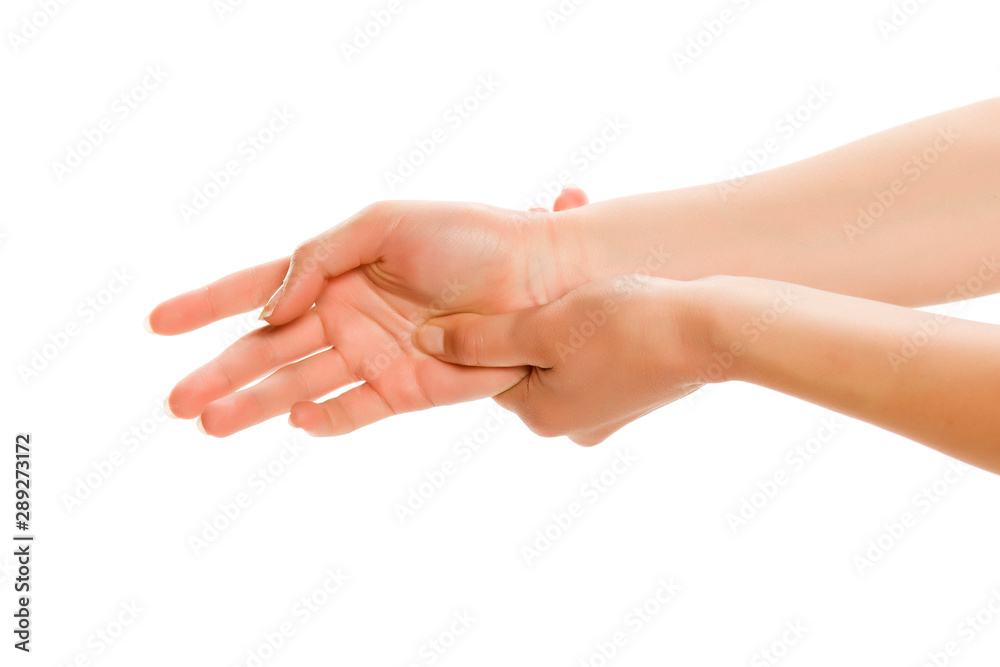 Young woman massaging her hand, isolated on white.