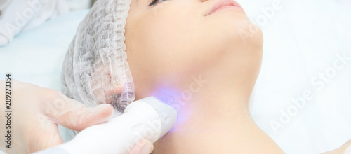 Dermatology skin care facial therapy. Medical spa anto wrinkles procedure. Woman face rejuvenation. Pretty girl. Rf cosmetician equipment. Chin and neck