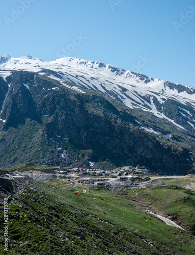 Vehical on the road to Rohtang pass in June photo