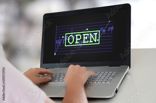 Open stock market concept on a laptop