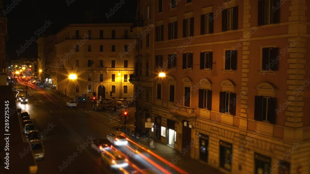 Overhead shot timelapse of a busy street full of cars at night in Rome, Italy. Vacation, holidays, travel in Europe. Overhead shot timelapse of a busy street full of cars at night in Rome, Italy. Vacation, holidays, travel in Europe.