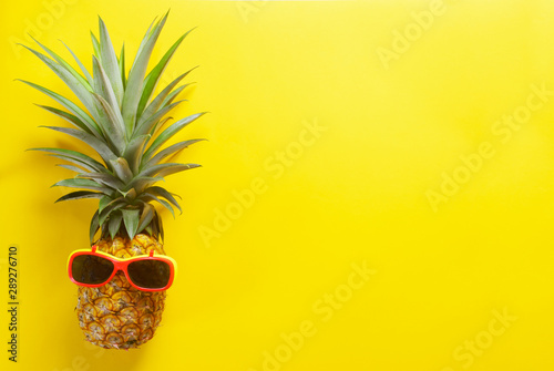 pineapple with glasses. summer fruit concept. 