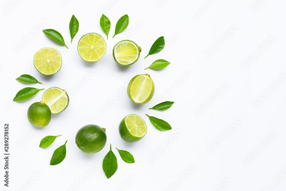 Limes with leaves isolated on white background. Limes with leaves isolated on white background.