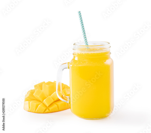 Fresh tropical mango juice with beautiful diced pulp and striped paper straw isolated on white background table, close up, cut out, clipping path.