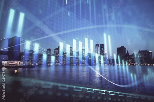 Financial graph on night city scape with tall buildings background double exposure. Analysis concept.