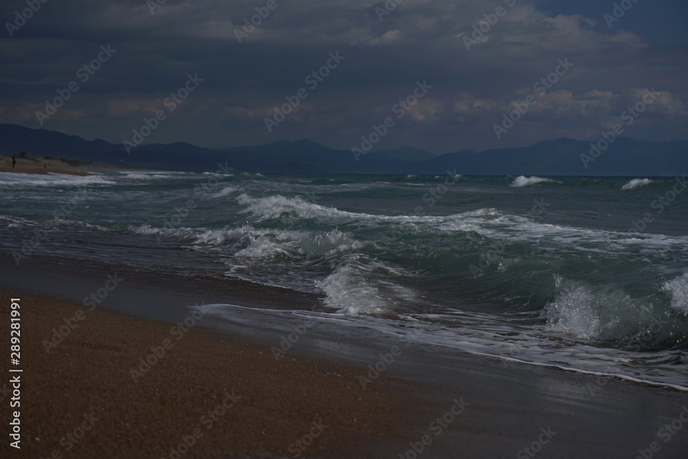 Waves at the coast of the mediterranean sea in greece