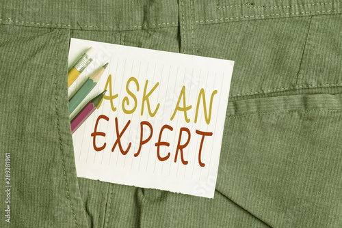 Word writing text Ask An Expert. Business photo showcasing consult someone who has skill about something or knowledgeable Writing equipment and white note paper inside pocket of man work trousers