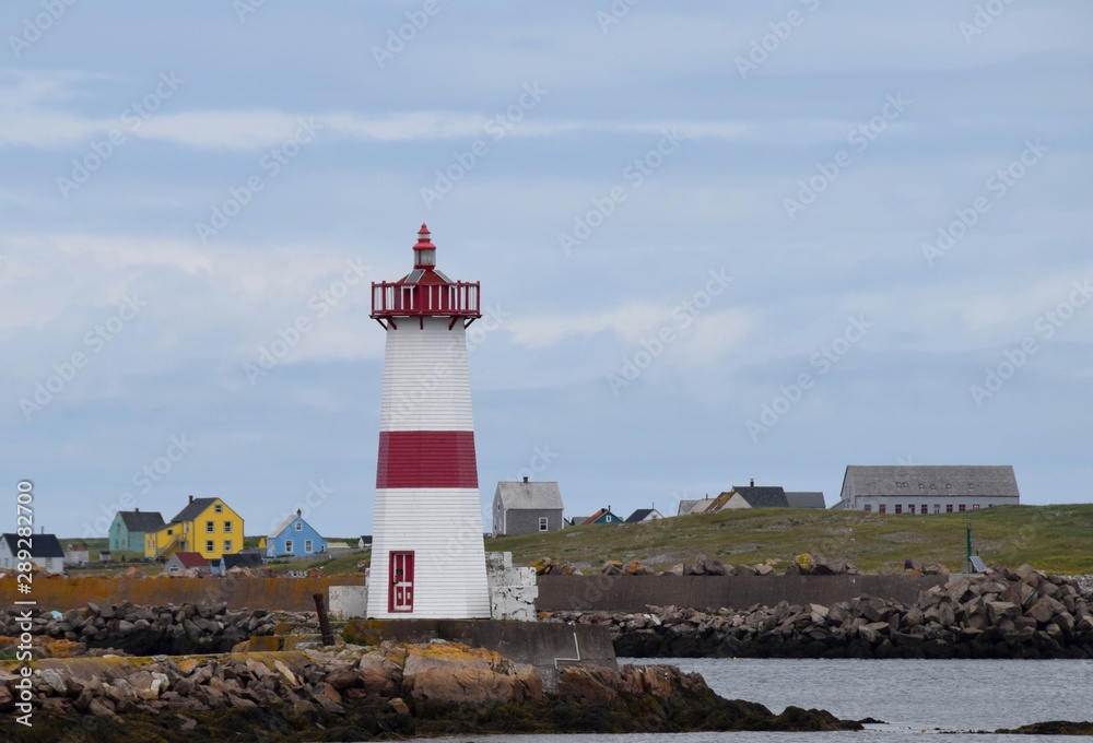 lighthouse  at Point aux Canons on Saint Pierre island, Ile aux Marion in the background  Saint Pierre and Miquelon
