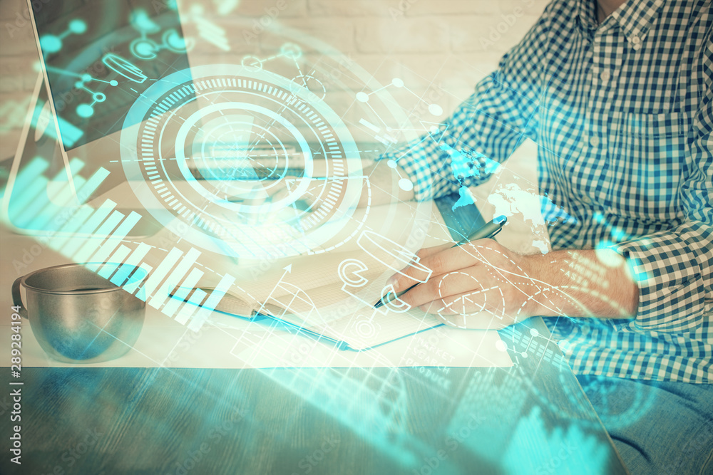 Multi exposure of businessman working on laptop on background. International business hologram in front. Concept of success. Multi exposure of businessman working on laptop on background. International business hologram in front. Concept of success.