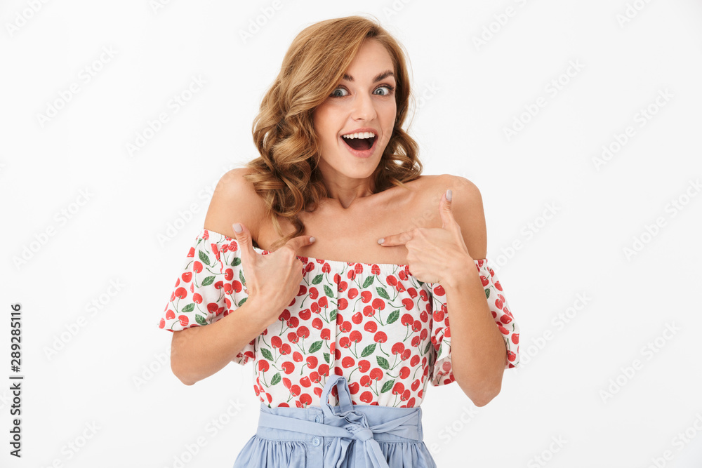 Surprised cheery woman posing isolated over white wall background pointing to hersef. Surprised cheery woman posing isolated over white wall background pointing to hersef.