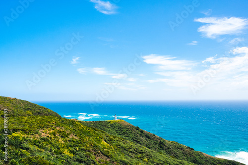 Cape Reinga, Northland, New Zealand. Beautiful landscape scenery of the mountain meadow and blue sky. © Klanarong Chitmung