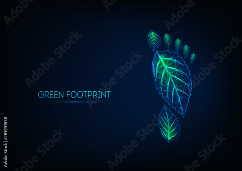 Futuristic glowing low poly human footprint made of green leaves isolated on dark blue background