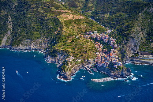 Panorama view of Manarola village one of Cinque Terre in La Spezia, Italy. Flight by a drone.