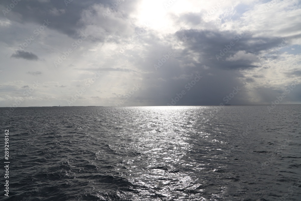 Fototapeta premium sea and sky in the silvery light of the sunset