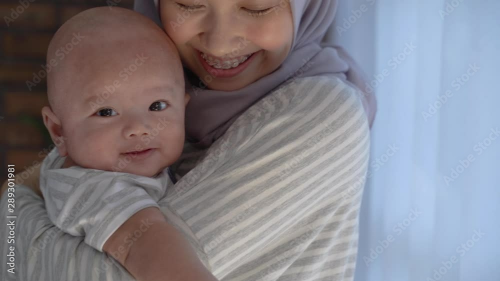toddler with mother. young muslim woman with infant baby son toddler with mother. young muslim woman with infant baby son