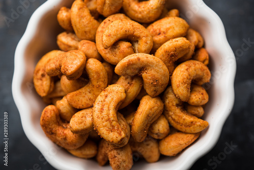 Masala Kaju or spicy Cashew in a bowl. Popular festival snack from India/asia, also known as Chakna recipe