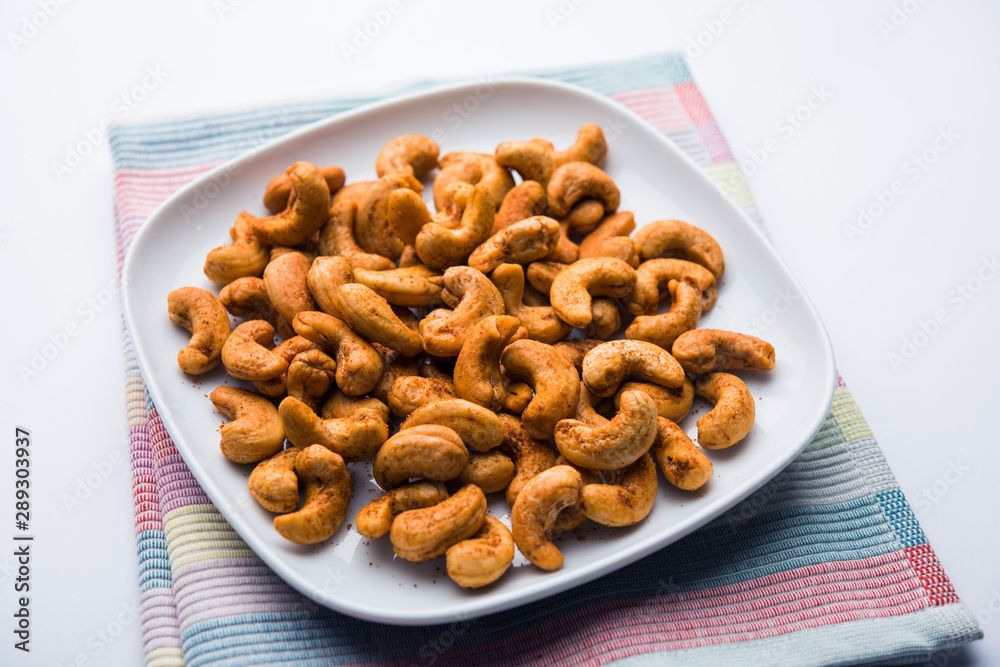 Masala Kaju or spicy Cashew in a bowl. Popular festival snack from India/asia, also known as Chakna recipe