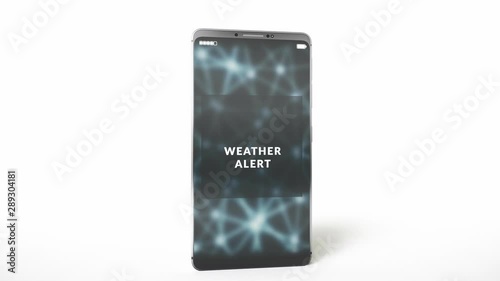 Weather alert notification on a smartphone display screen. Disaster and hazard warning message sent by emergency public warning system. Simple studio light, device isolated on white background.