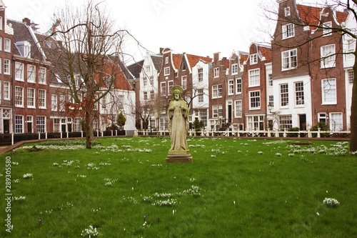 The quarter of the Beguines of Amstedam. Beguinage in the secret garden of the Beguines in Amsterdam on a winter day
