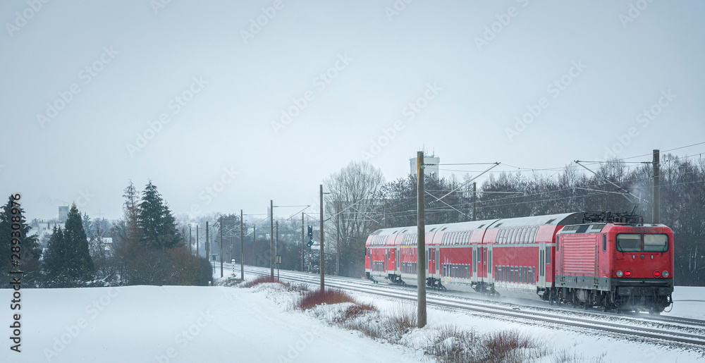 Fotografie Passengers train in the winter scenery