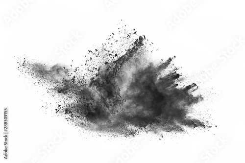 Particles of charcoal on white background,abstract powder splatted on white background,Freeze motion of black powder exploding or throwing black powder.